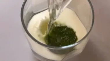 Frozen chaas cubes made with herbs and spices in an ice tray